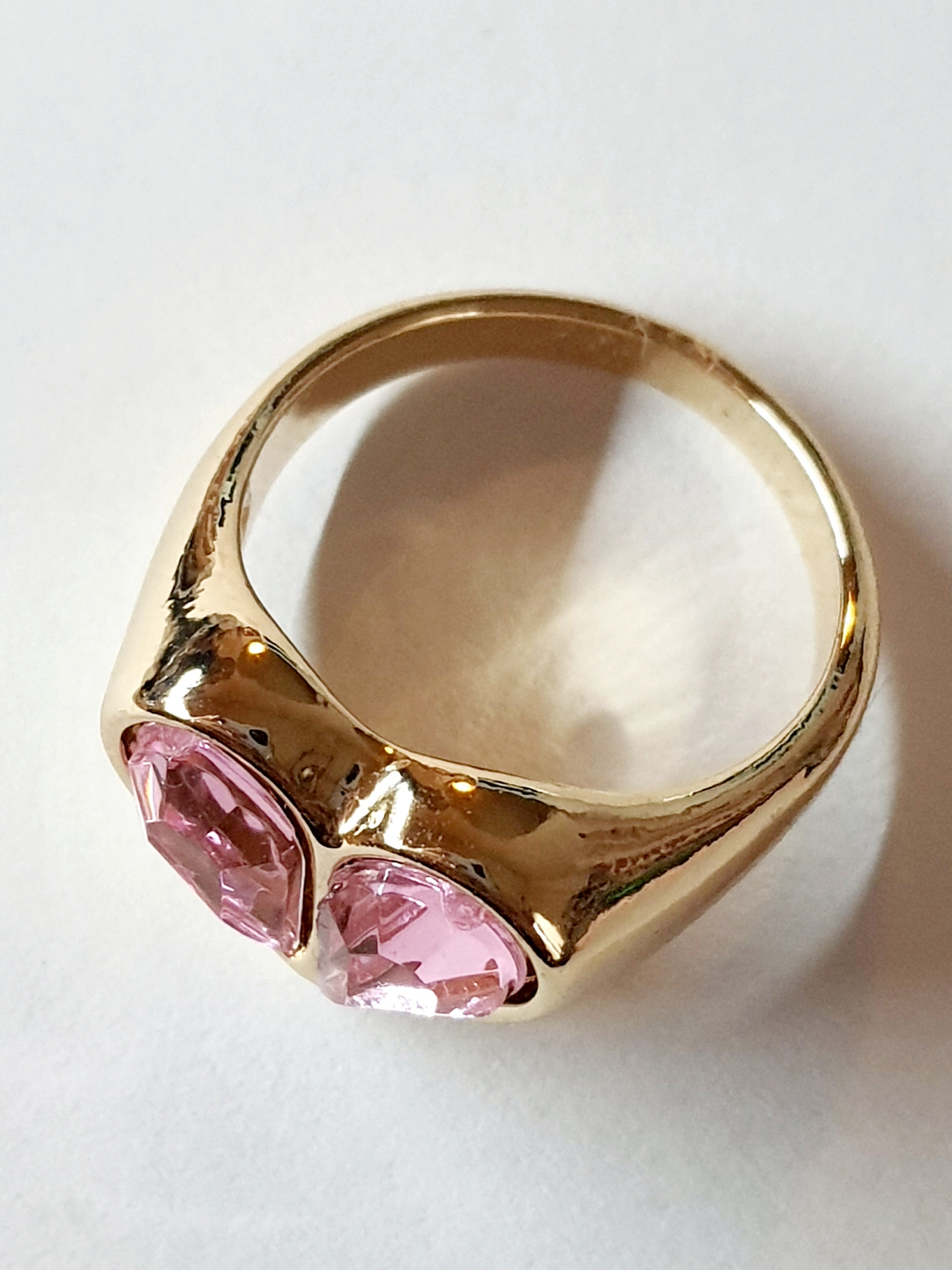 Gold ring with pink hearts – romantic charm and femininity