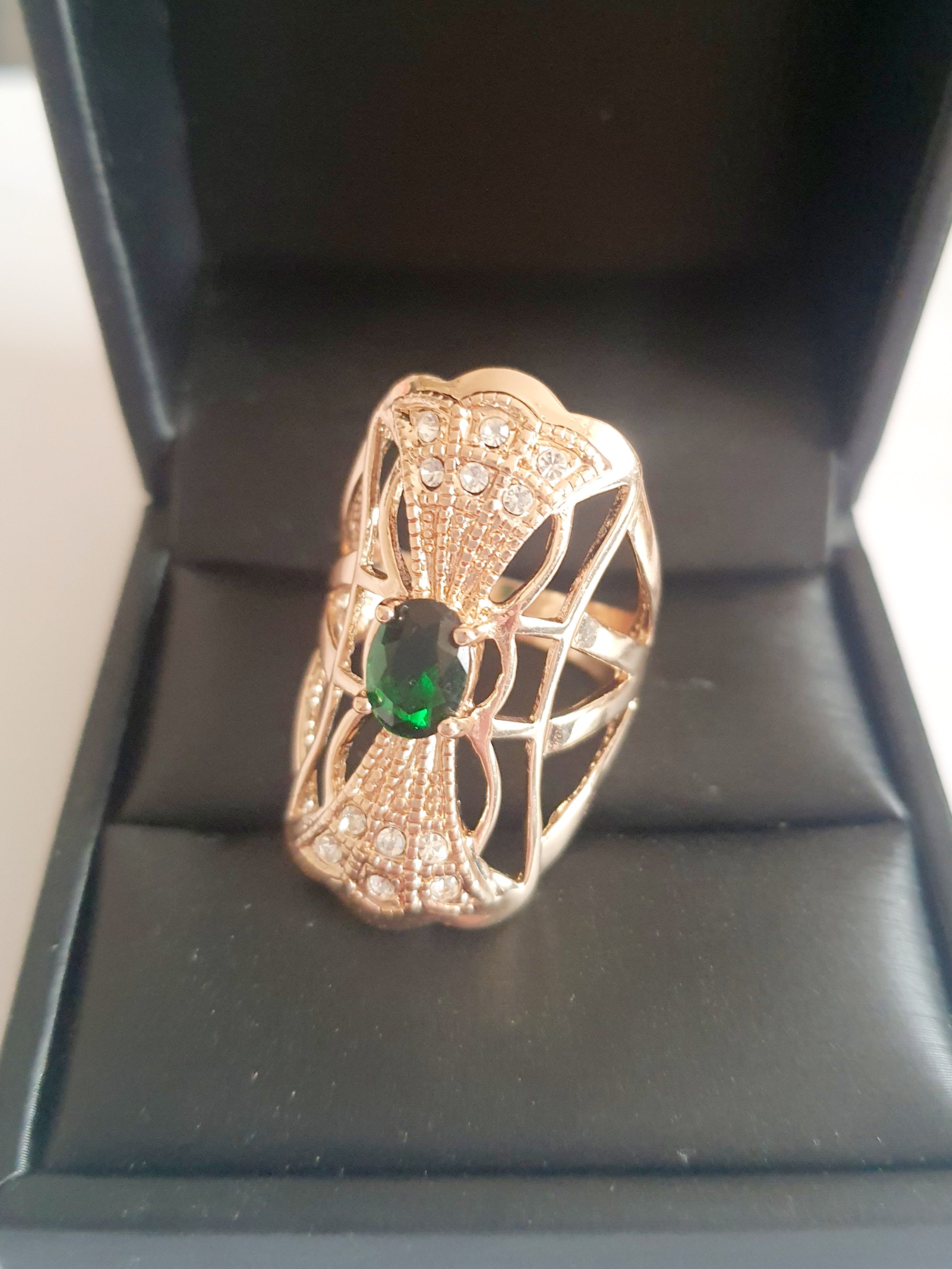 Emerald Crown of Sparkle – a decorative vintage ring with a green stone
