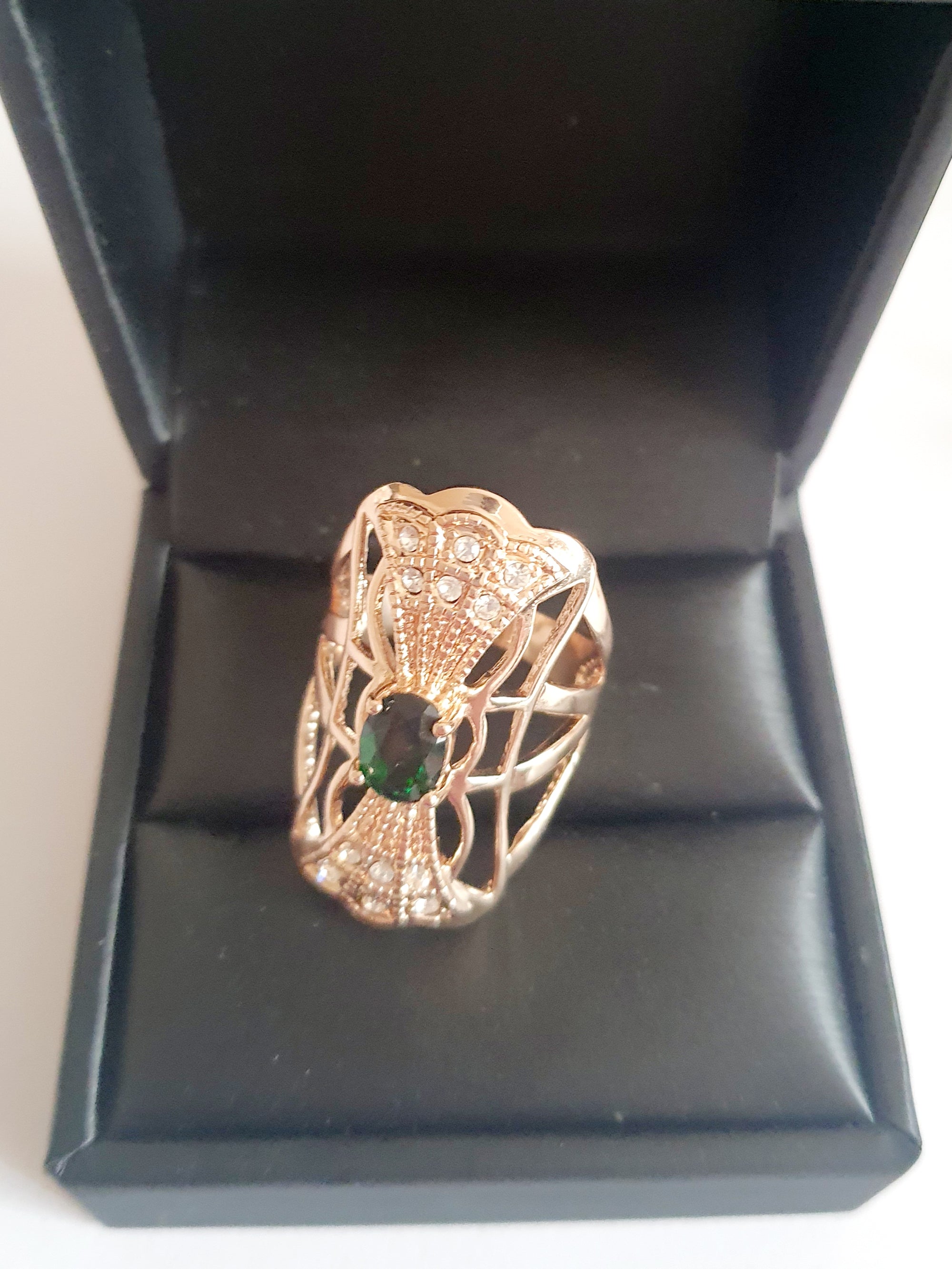 Emerald Crown of Sparkle – a decorative vintage ring with a green stone