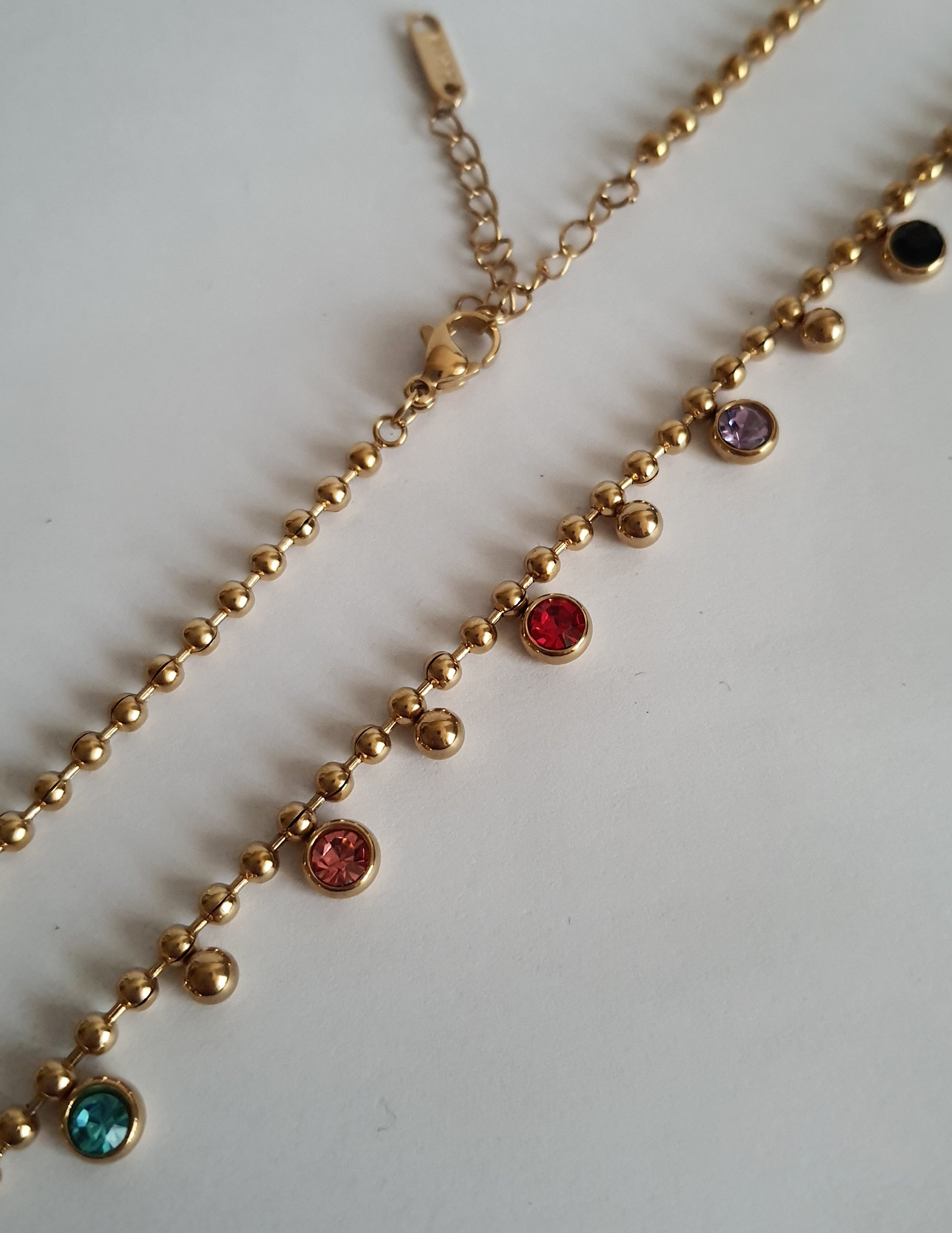 Rose Cross – Gold necklace with pink crystals and a Mary medallion