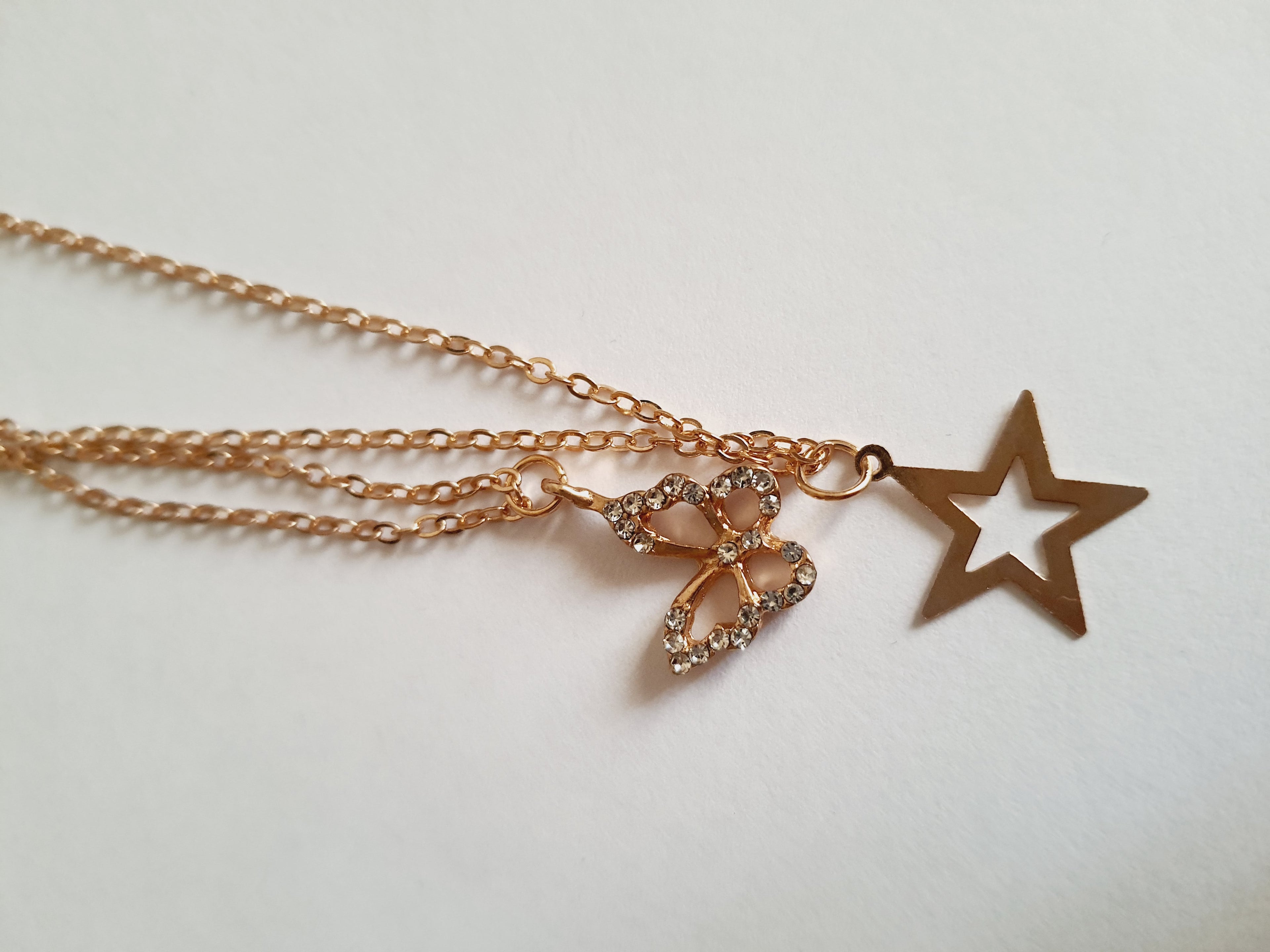 Złoty zestaw dwóch łańcuszków z zawieszką gwiazdki i motylka, biżuteria z regulacją | RougeBizu

