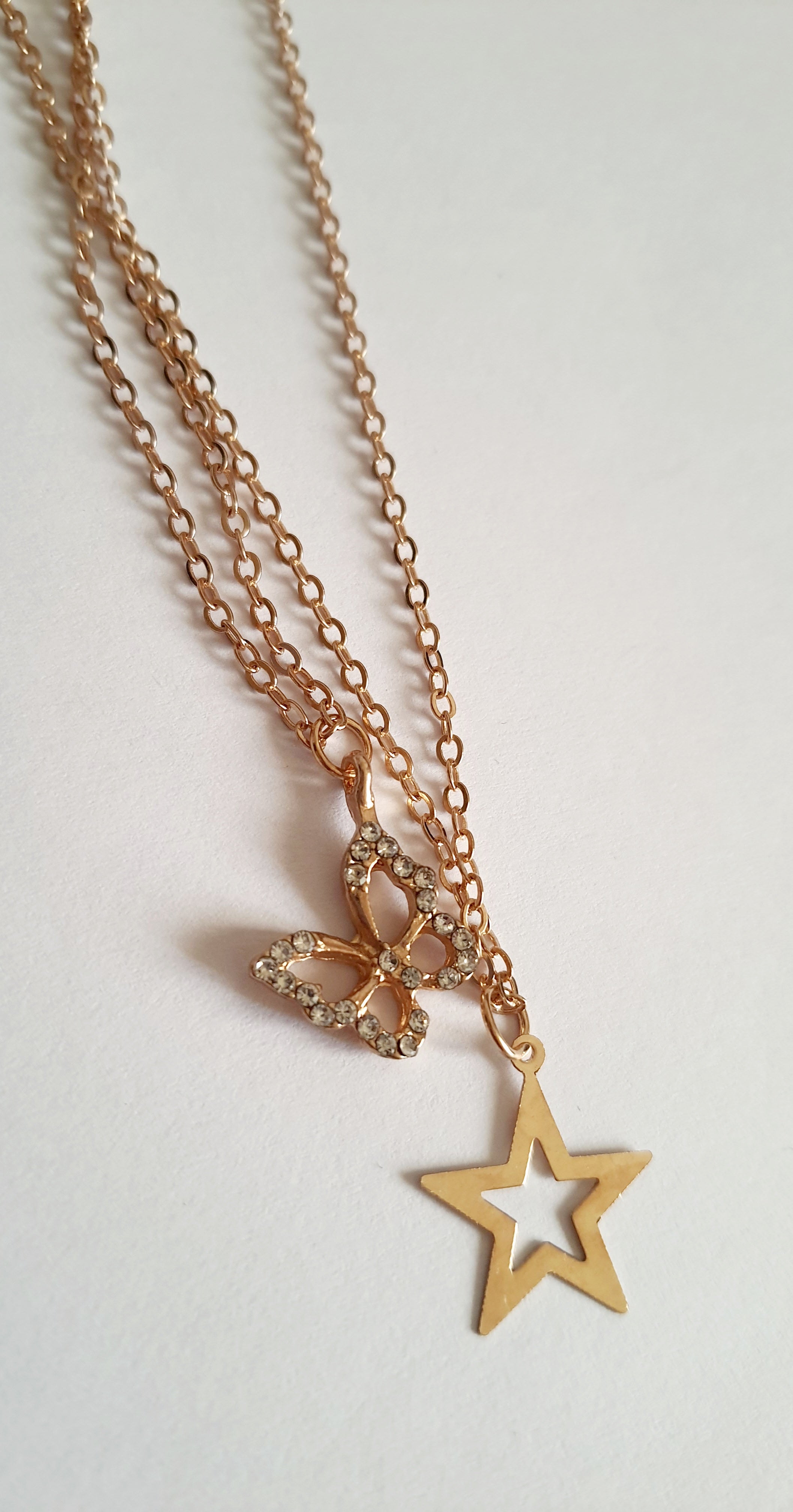 Złoty zestaw dwóch łańcuszków z zawieszką gwiazdki i motylka, biżuteria z regulacją | RougeBizu

