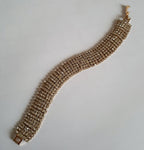 Szeroka bransoletka glamour ze stali nierdzewnej, złocona, w całości wysadzana rzędami cyrkonii, długość 19 cm, RougeBizu.