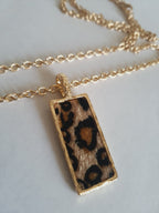 Rose Cross – Gold necklace with pink crystals and a Mary medallion