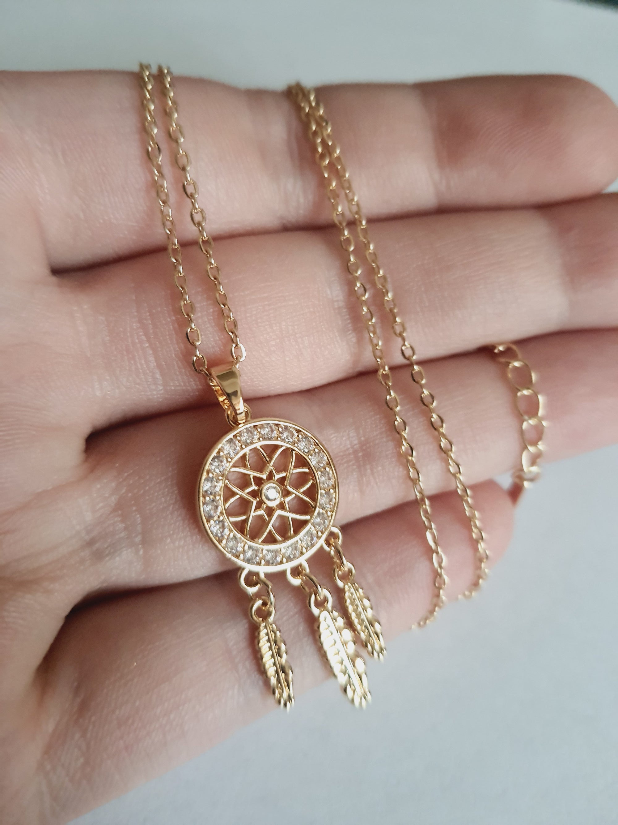 Rose Cross – Gold necklace with pink crystals and a Mary medallion