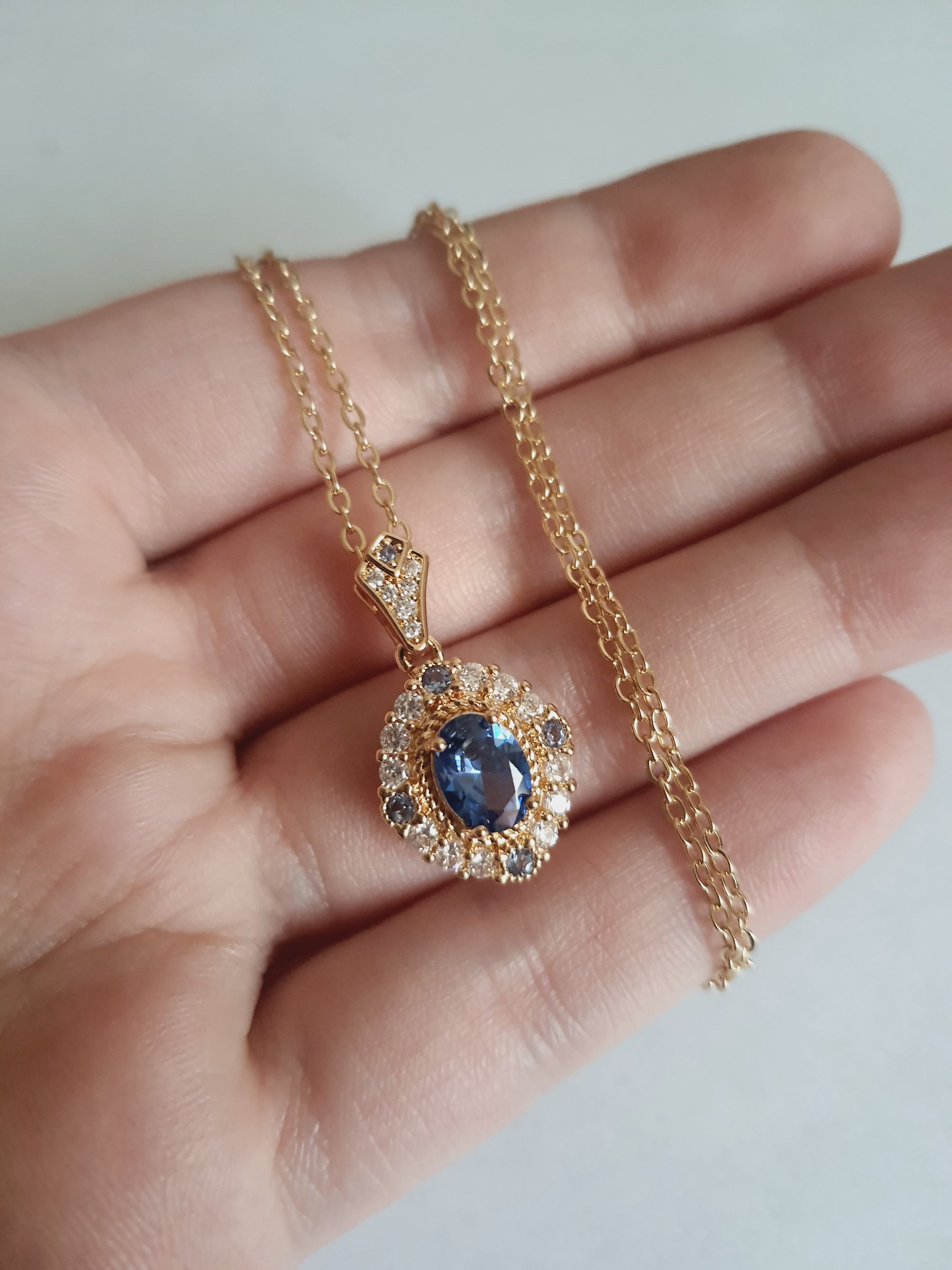 Rose Cross – Gold necklace with pink crystals and a Mary medallion