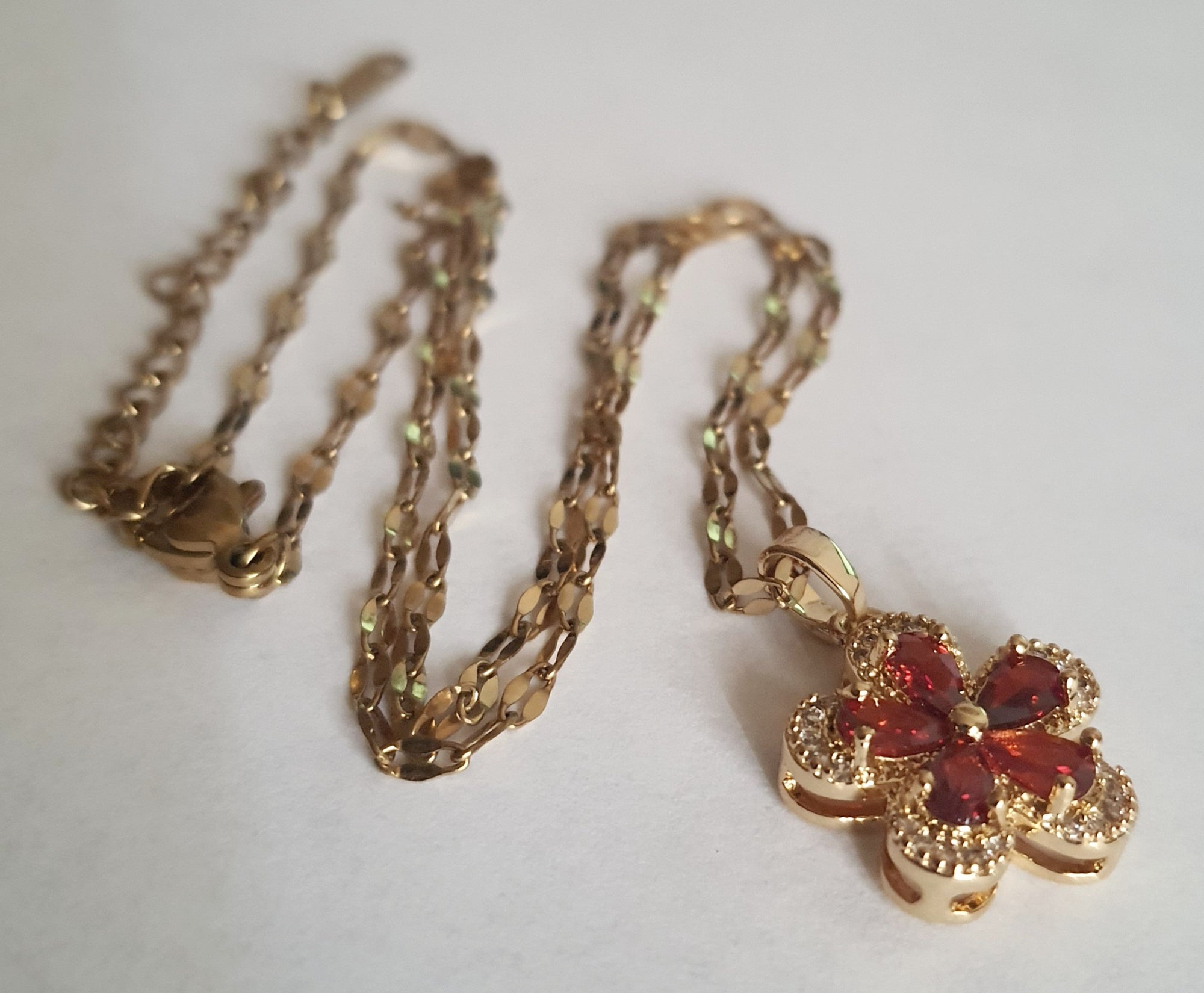 Rose Cross – Gold necklace with pink crystals and a Mary medallion