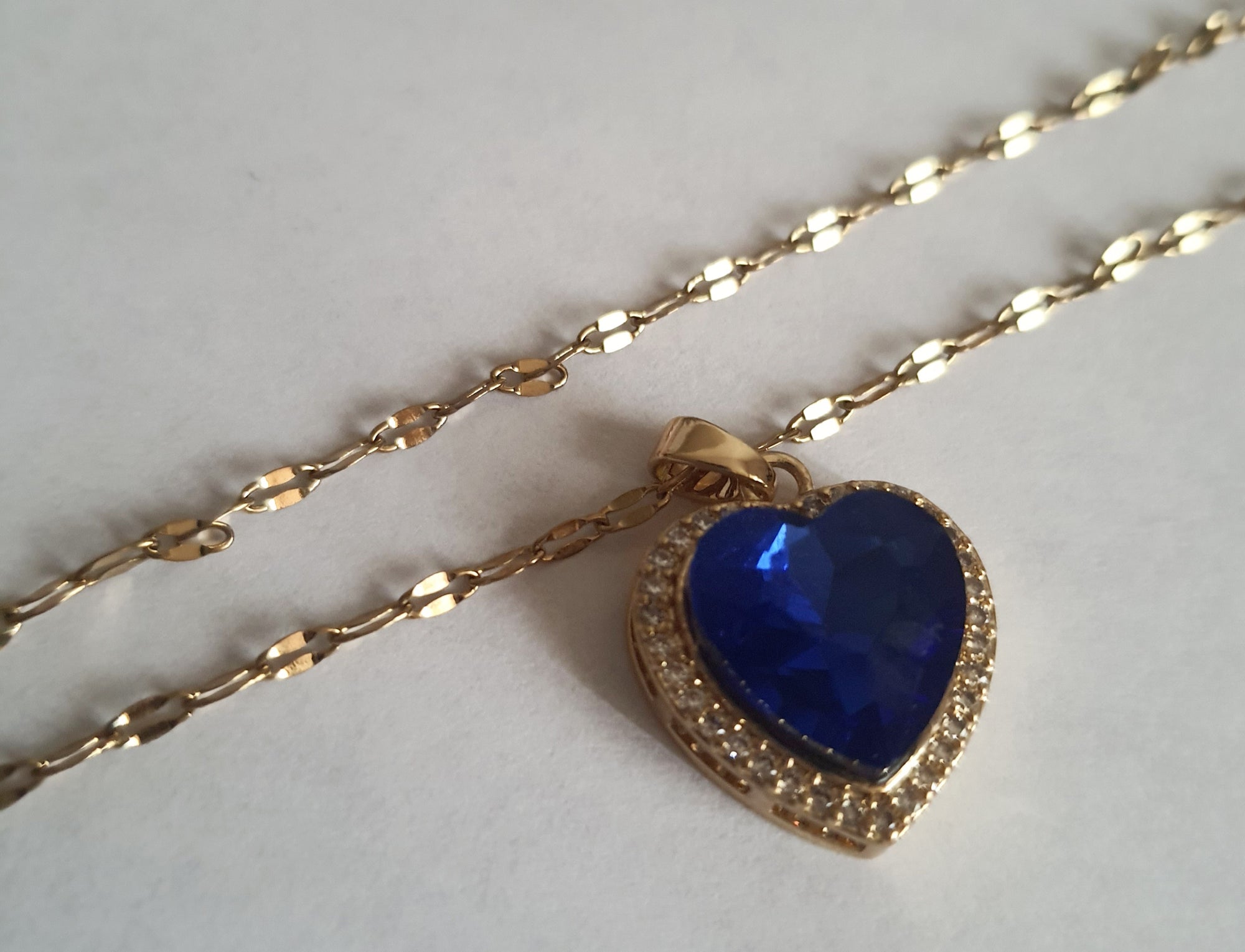 Rose Cross – Gold necklace with pink crystals and a Mary medallion