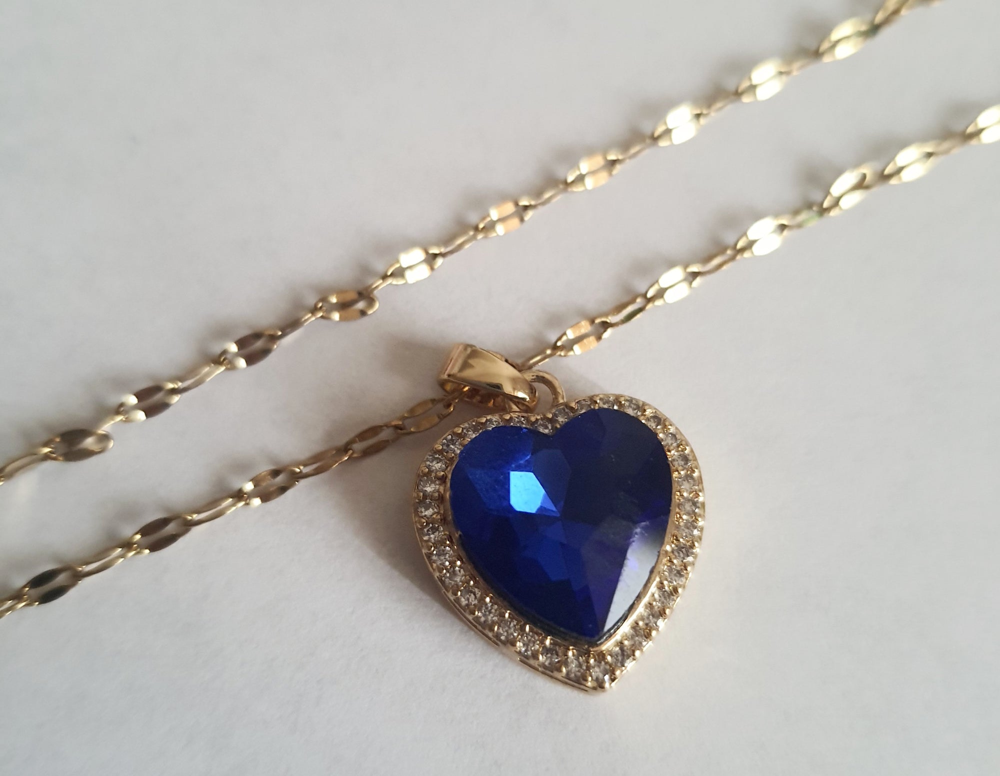 Rose Cross – Gold necklace with pink crystals and a Mary medallion