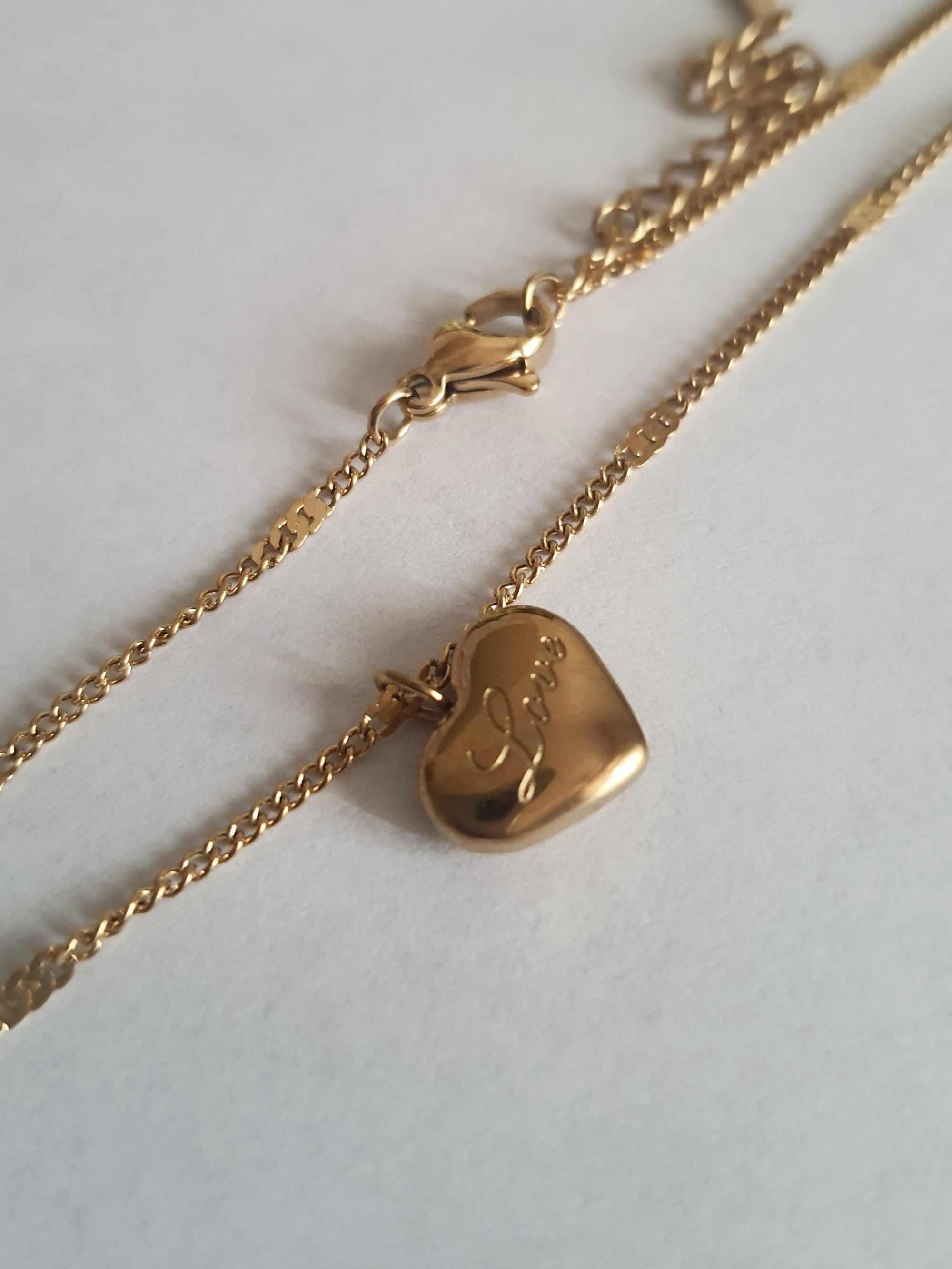 Rose Cross – Gold necklace with pink crystals and a Mary medallion