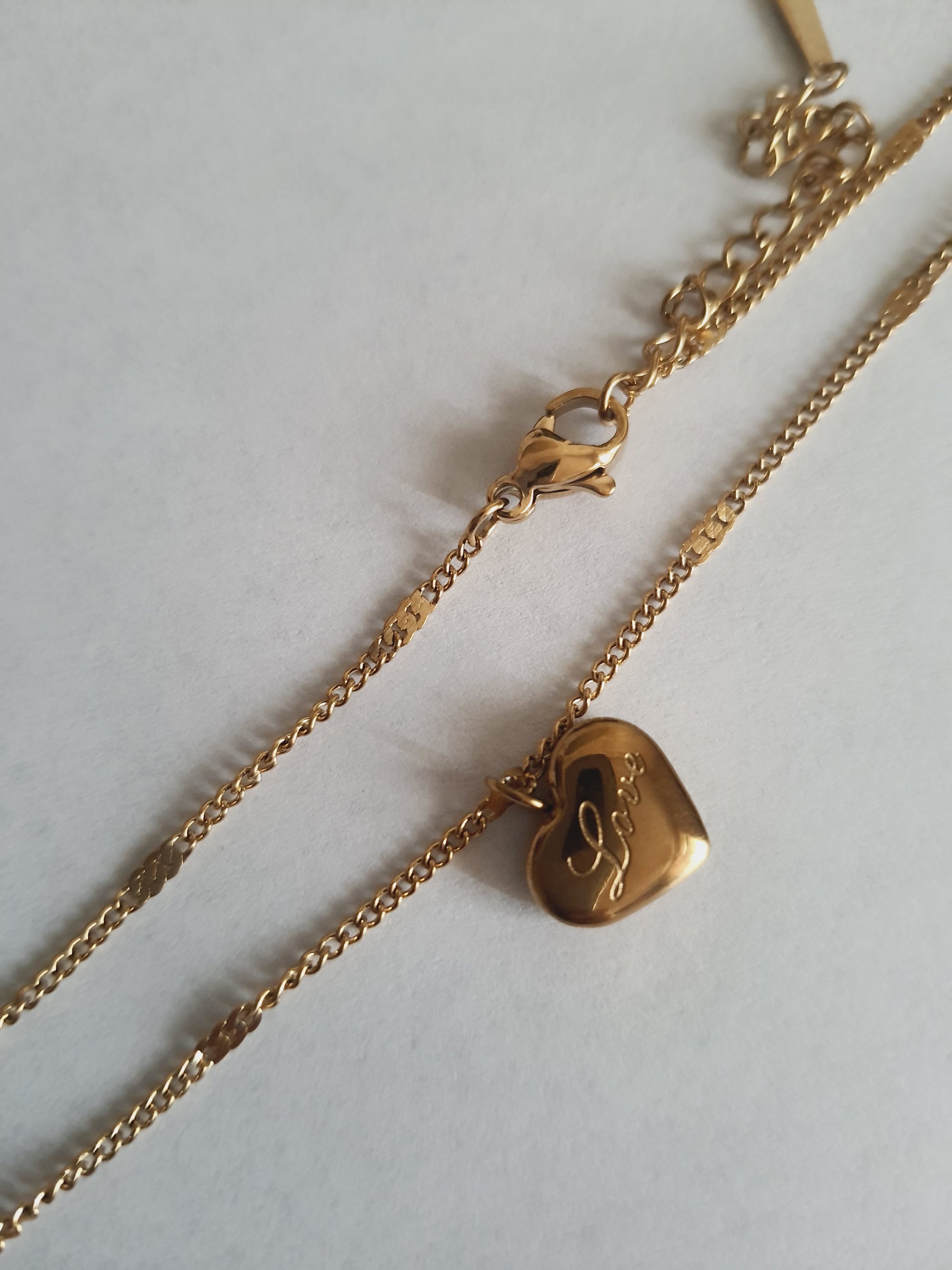 Rose Cross – Gold necklace with pink crystals and a Mary medallion
