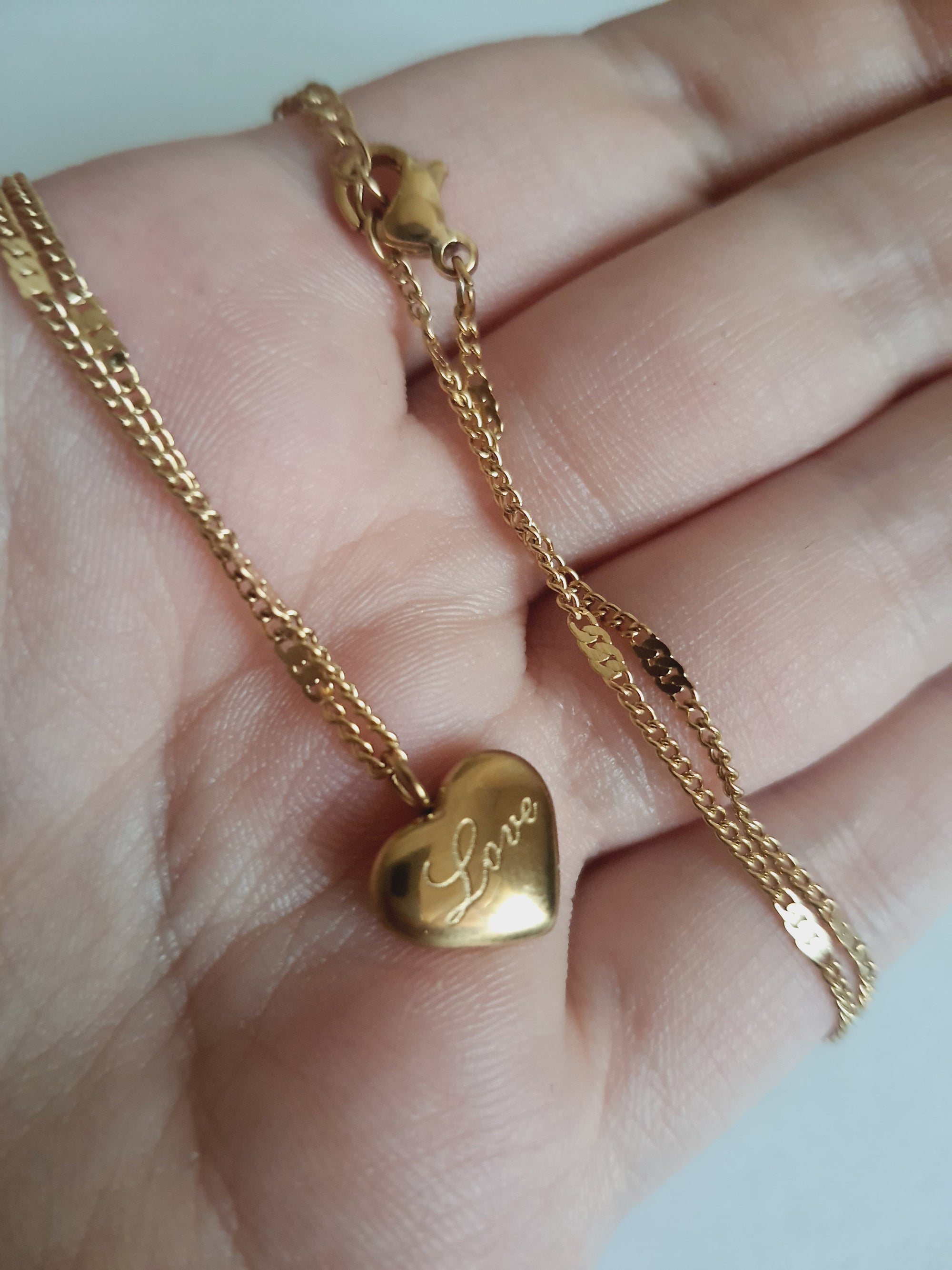 Rose Cross – Gold necklace with pink crystals and a Mary medallion