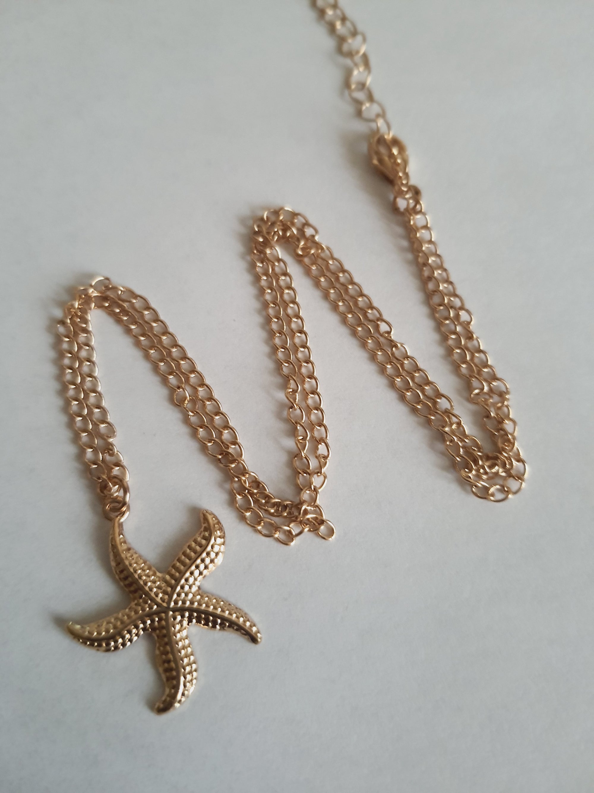 Rose Cross – Gold necklace with pink crystals and a Mary medallion