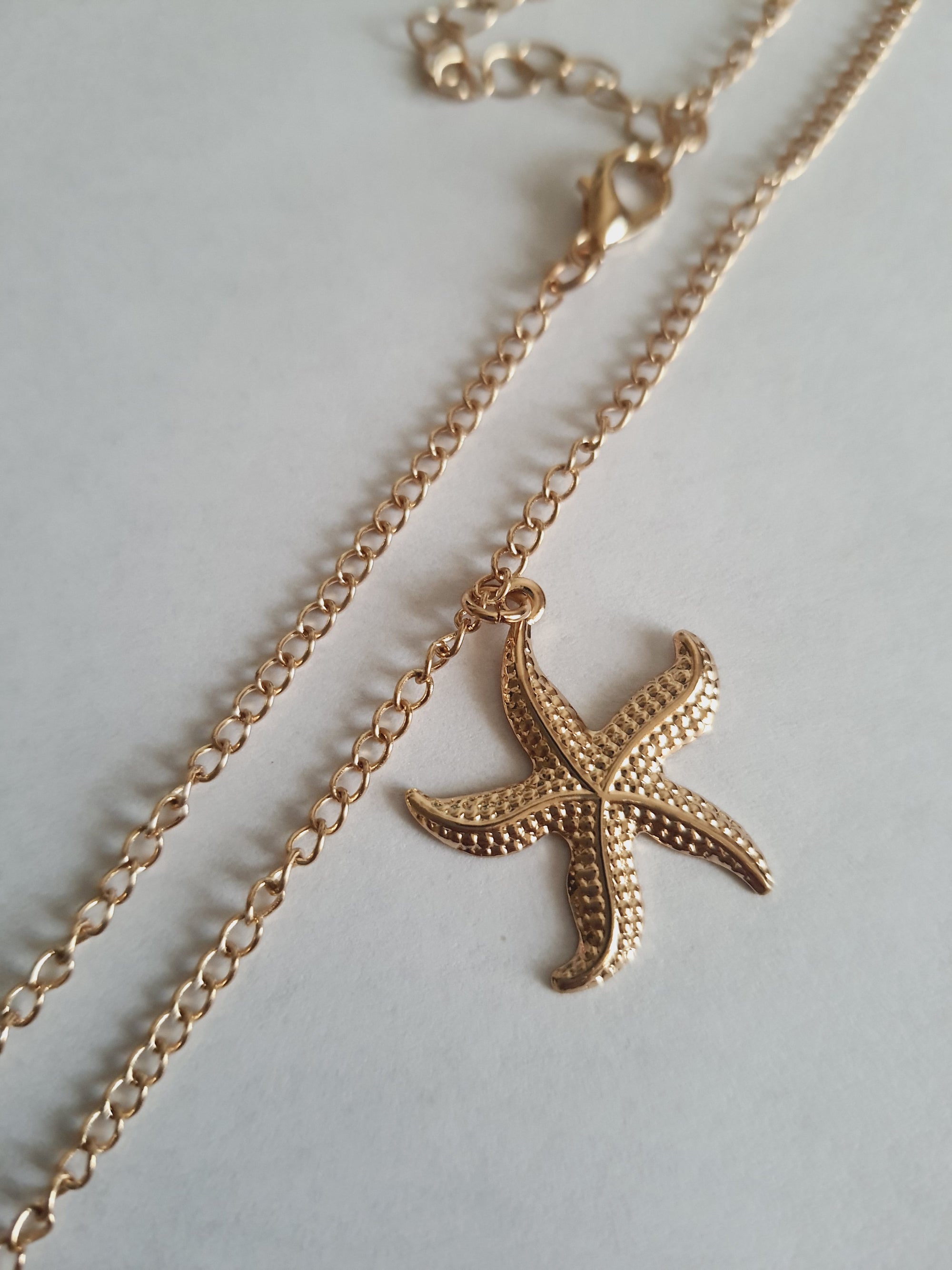 Rose Cross – Gold necklace with pink crystals and a Mary medallion