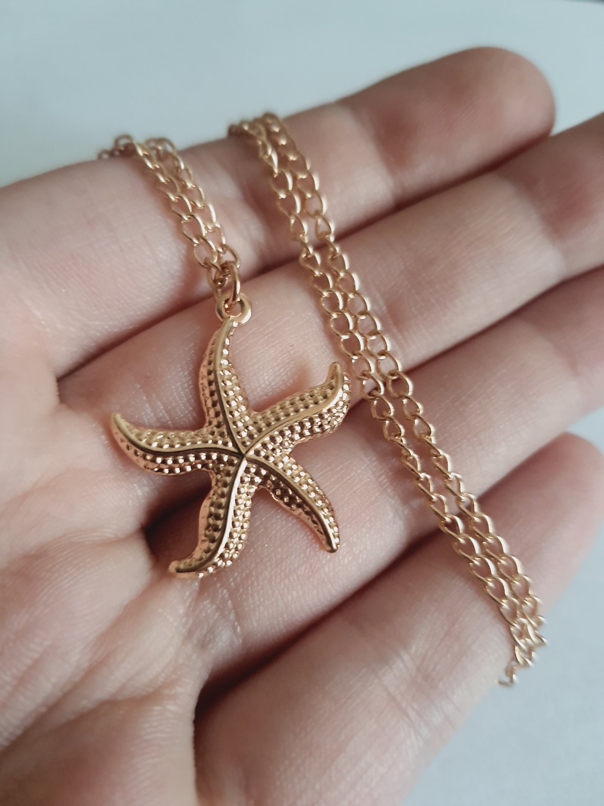 Rose Cross – Gold necklace with pink crystals and a Mary medallion