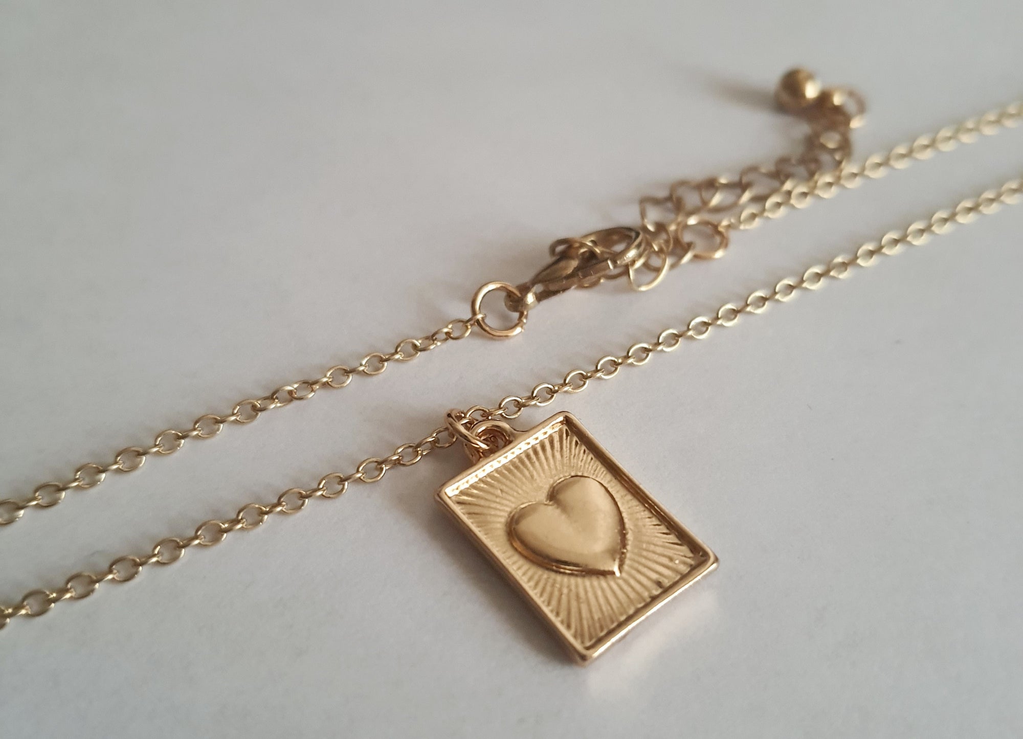 Rose Cross – Gold necklace with pink crystals and a Mary medallion