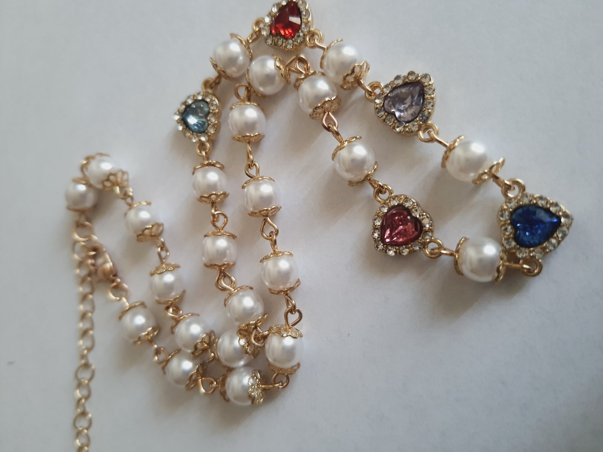 Rose Cross – Gold necklace with pink crystals and a Mary medallion
