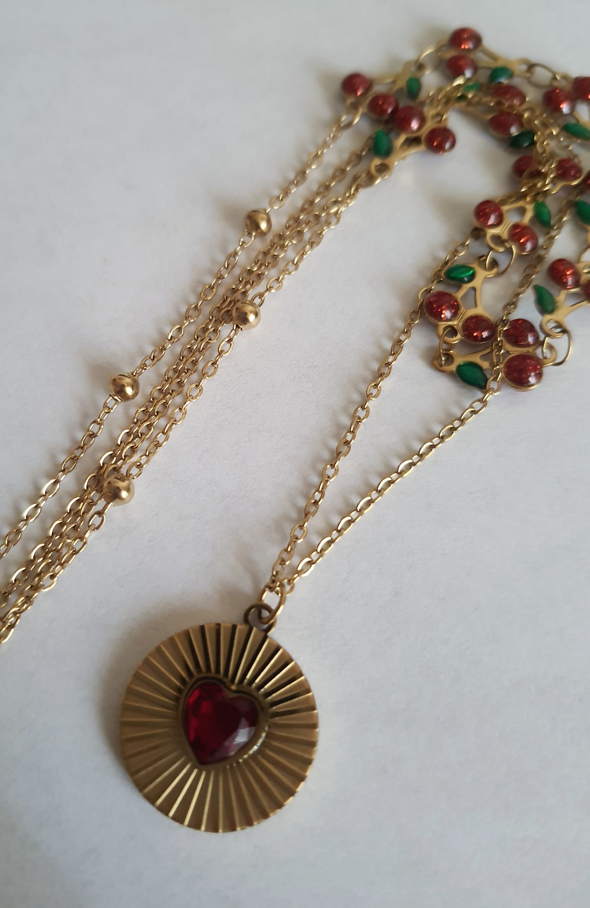Rose Cross – Gold necklace with pink crystals and a Mary medallion
