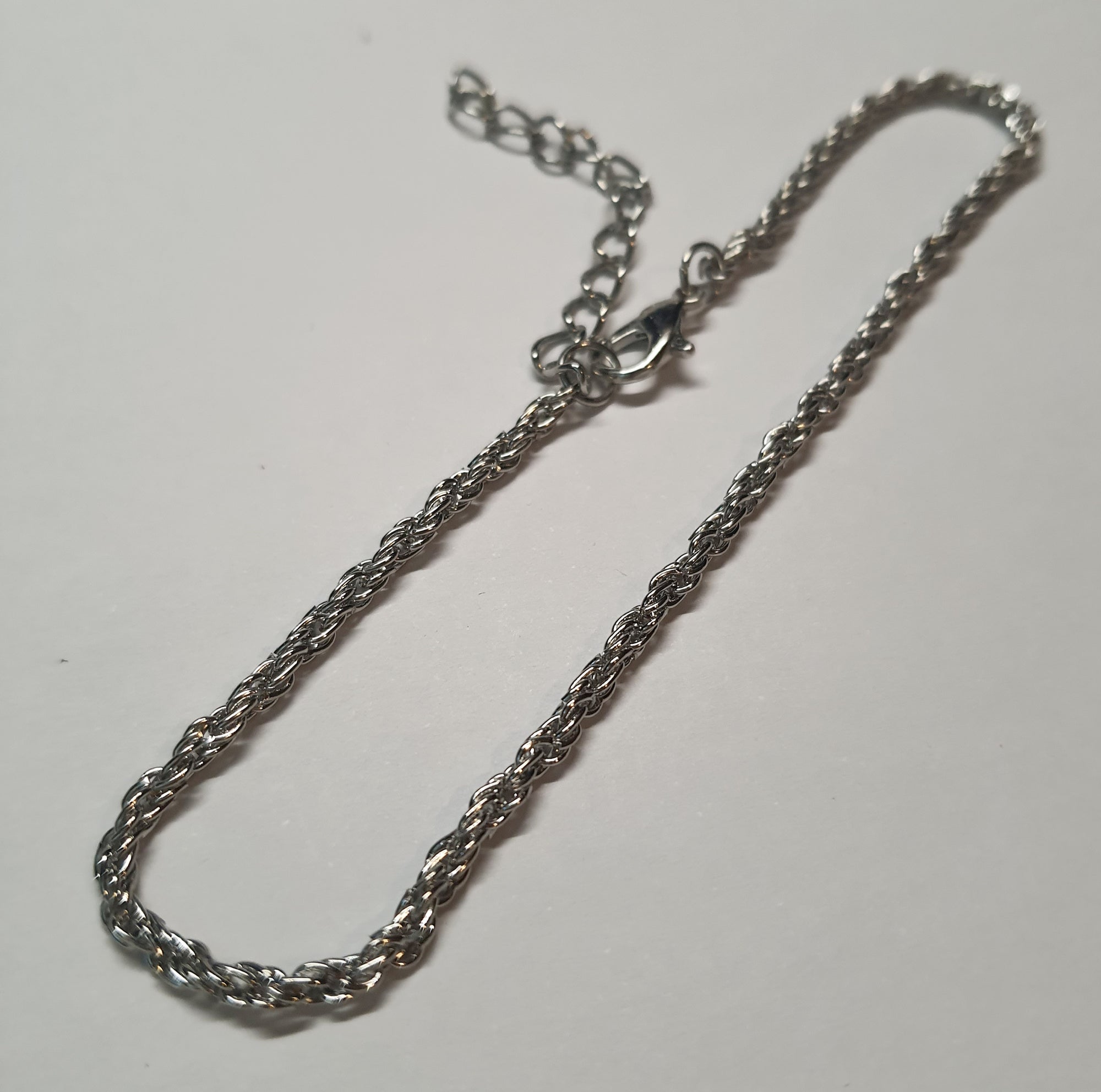 Srebrna bransoletka o splocie kordel, stal chirurgiczna, stal nierdzewna, wodoodporne, hipoalergiczne, jakość premium, długość regulowana 21–28 cm, RougeBizu.