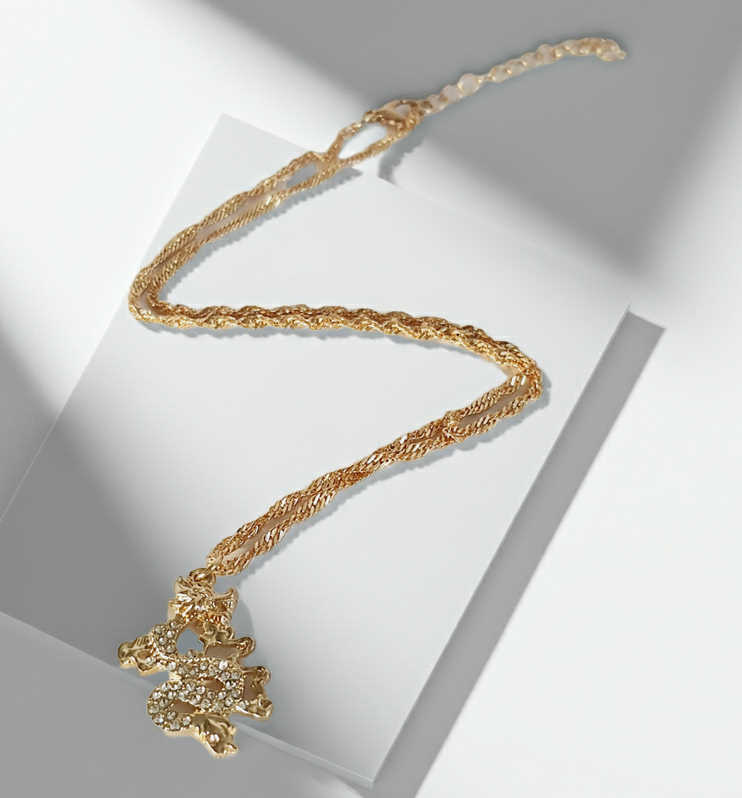 Rose Cross – Gold necklace with pink crystals and a Mary medallion