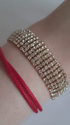 Szeroka bransoletka glamour ze stali nierdzewnej, złocona, w całości wysadzana rzędami cyrkonii, długość 19 cm, RougeBizu.